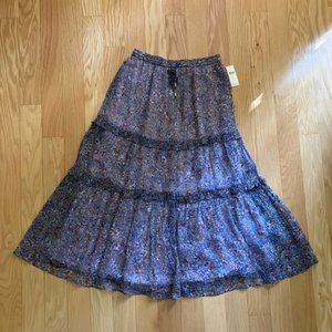 Anthropologie lavender skirt with multi colored flowers in size 2